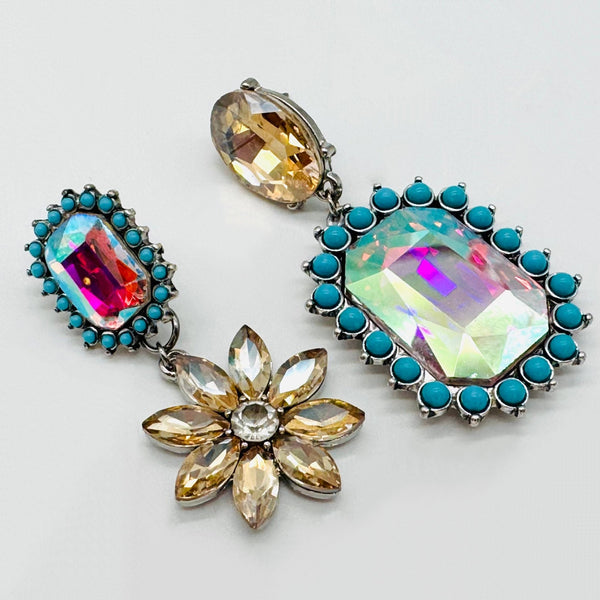 Handgemaakt statement oorbel blue champagne flower handgemaakt door MUZE earrings. Gratis geleverd binnen nederland en belgie.