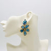 Handgemaakt statement oorbel blue swarovski flower handgemaakt door MUZE earrings. Gratis geleverd binnen nederland en belgie.