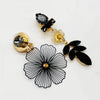 Handgemaakt statement oorbel clip blooming black grey handgemaakt door MUZE earrings. Gratis geleverd binnen nederland en belgie.