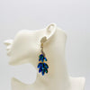Handgemaakt statement oorbel earrings blue ab peacock handgemaakt door MUZE earrings. Gratis geleverd binnen nederland en belgie.