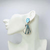 Handgemaakt statement oorbel earrings blue glam shell handgemaakt door MUZE earrings. Gratis geleverd binnen nederland en belgie.
