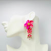 Handgemaakt statement oorbel earrings fuchsia flowers handgemaakt door MUZE earrings. Gratis geleverd binnen nederland en belgie.