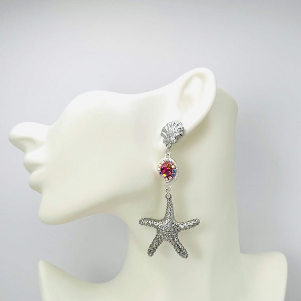 Handgemaakt statement oorbel earrings fuchsia pink shell handgemaakt door MUZE earrings. Gratis geleverd binnen nederland en belgie.