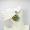 Handgemaakt statement oorbel earrings luminescence shell handgemaakt door MUZE earrings. Gratis geleverd binnen nederland en belgie.