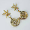 Handgemaakt statement oorbel earrings nautilus starfish handgemaakt door MUZE earrings. Gratis geleverd binnen nederland en belgie.