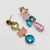 Handgemaakt statement oorbel earrings pink aqua dreams handgemaakt door MUZE earrings. Gratis geleverd binnen nederland en belgie.