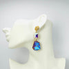 Handgemaakt statement oorbel earrings purple octopus handgemaakt door MUZE earrings. Gratis geleverd binnen nederland en belgie.