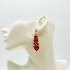 Handgemaakt statement oorbel earrings red strass crab handgemaakt door MUZE earrings. Gratis geleverd binnen nederland en belgie.