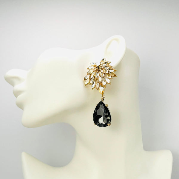 Handgemaakt statement oorbel grey champagne flower handgemaakt door MUZE earrings. Gratis geleverd binnen nederland en belgie.