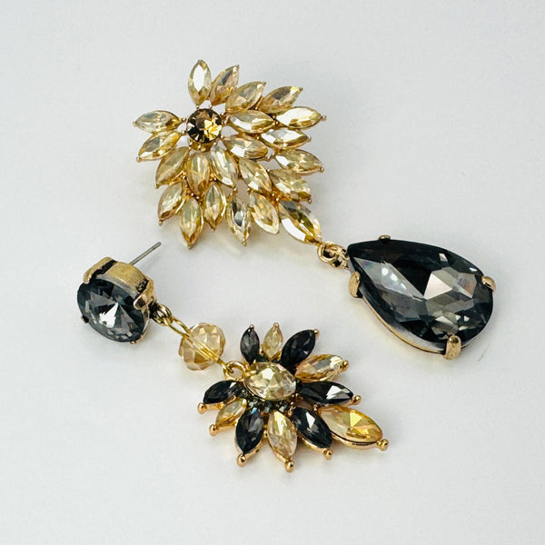 Handgemaakt statement oorbel grey champagne flower handgemaakt door MUZE earrings. Gratis geleverd binnen nederland en belgie.