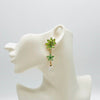 Handgemaakt statement oorbel light green flower handgemaakt door MUZE earrings. Gratis geleverd binnen nederland en belgie.
