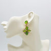 Handgemaakt statement oorbel light green flower handgemaakt door MUZE earrings. Gratis geleverd binnen nederland en belgie.