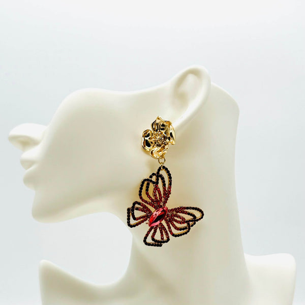Handgemaakt statement oorbel earrings big red butterfly handgemaakt door MUZE earrings. Gratis geleverd binnen nederland en belgie.
