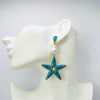 Handgemaakt statement oorbel earrings aqua starfish handgemaakt door MUZE earrings. Gratis geleverd binnen nederland en belgie.