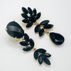 Handgemaakt statement oorbel black spring leafs handgemaakt door MUZE earrings. Gratis geleverd binnen nederland en belgie.