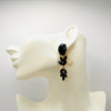 Handgemaakt statement oorbel black spring leafs handgemaakt door MUZE earrings. Gratis geleverd binnen nederland en belgie.
