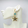 Handgemaakt statement oorbel earrings aqua cowrie shell handgemaakt door MUZE earrings. Gratis geleverd binnen nederland en belgie.