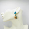 Handgemaakt statement oorbel earrings aqua peach glam handgemaakt door MUZE earrings. Gratis geleverd binnen nederland en belgie.