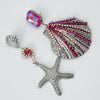 Handgemaakt statement oorbel earrings fuchsia pink shell handgemaakt door MUZE earrings. Gratis geleverd binnen nederland en belgie.