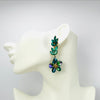Handgemaakt statement oorbel earrings green flowers handgemaakt door MUZE earrings. Gratis geleverd binnen nederland en belgie.