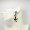 Handgemaakt statement oorbel earrings luminescence shell handgemaakt door MUZE earrings. Gratis geleverd binnen nederland en belgie.