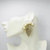 Handgemaakt statement oorbel earrings pearly white jellyfish handgemaakt door MUZE earrings. Gratis geleverd binnen nederland en belgie.