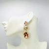 Handgemaakt statement oorbel earrings pink scorpion handgemaakt door MUZE earrings. Gratis geleverd binnen nederland en belgie.