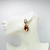 Handgemaakt statement oorbel earrings small peach glam handgemaakt door MUZE earrings. Gratis geleverd binnen nederland en belgie.