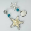 Handgemaakt statement oorbel earrings starfish cockle handgemaakt door MUZE earrings. Gratis geleverd binnen nederland en belgie.