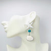 Handgemaakt statement oorbel earrings starfish cockle handgemaakt door MUZE earrings. Gratis geleverd binnen nederland en belgie.